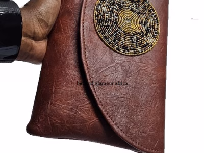 Ladies brown leather clutch bag very fashionable to have