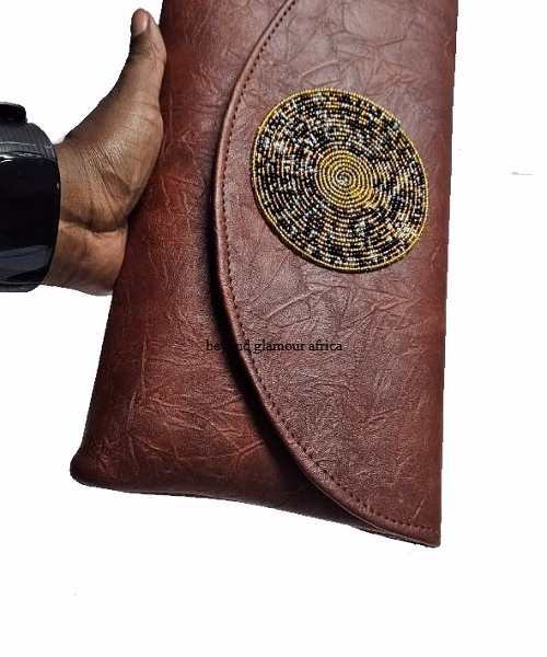 Ladies brown leather clutch bag very fashionable to have