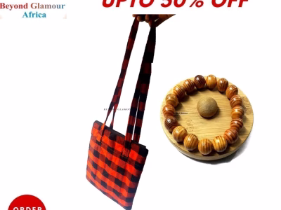 A black and red sling bag and brown wooden bracelet