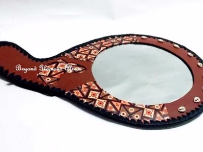 A brown leather mirror very fashionable to have