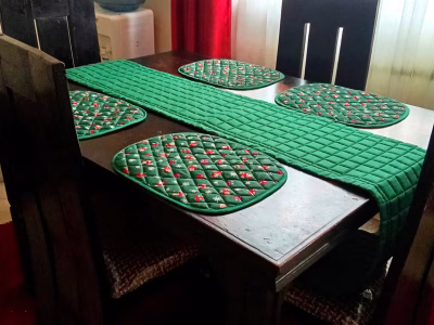 Customised table mats,runner and cup coasters.