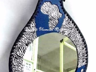 A blue leather calabash mirror