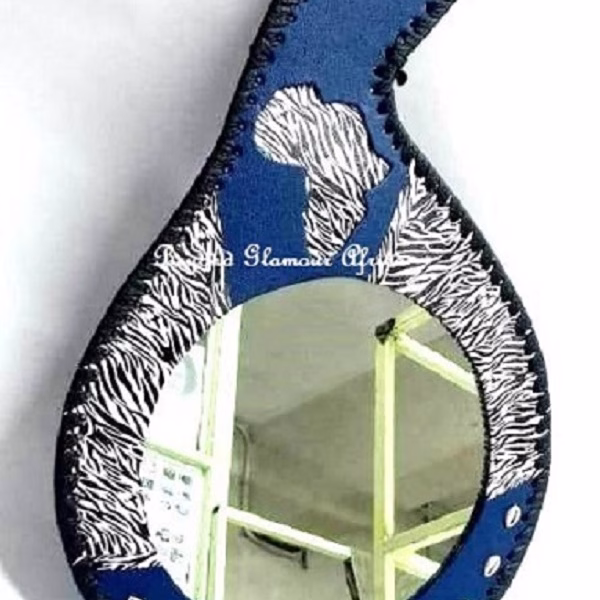 A blue leather calabash mirror