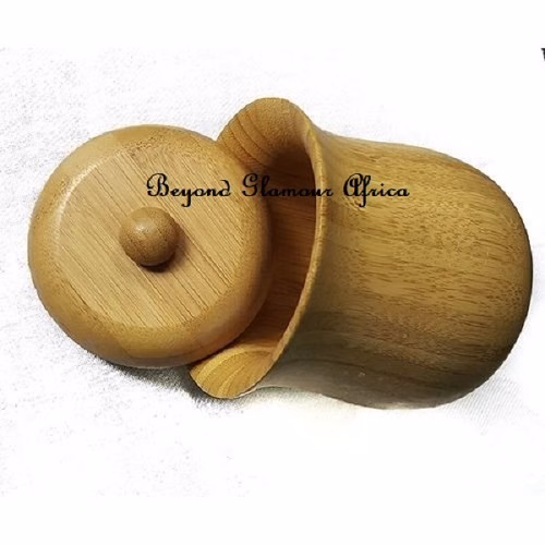 A wooden sugar dish
