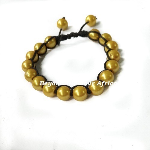 A multicolored knitted scarf and a yellow bracelet combo